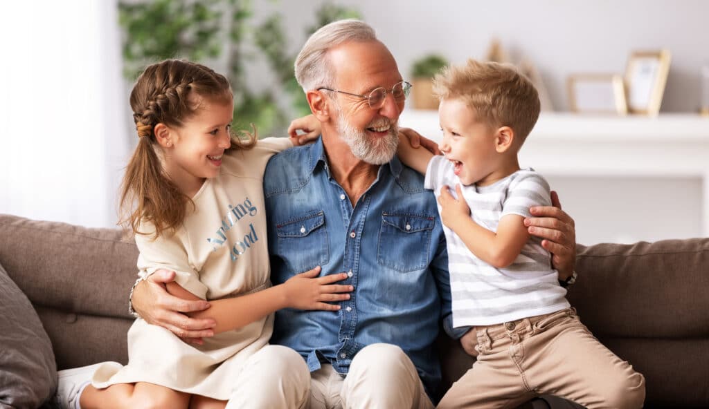 Grandfather sharing joyful moments with his grandchildren.
